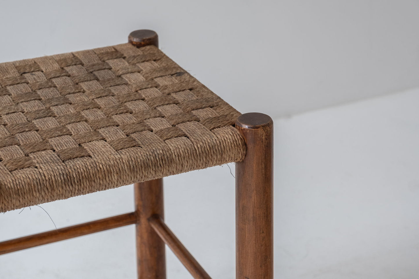 A charming set of two stools with papercord seats, crafted in France during the 1960s.