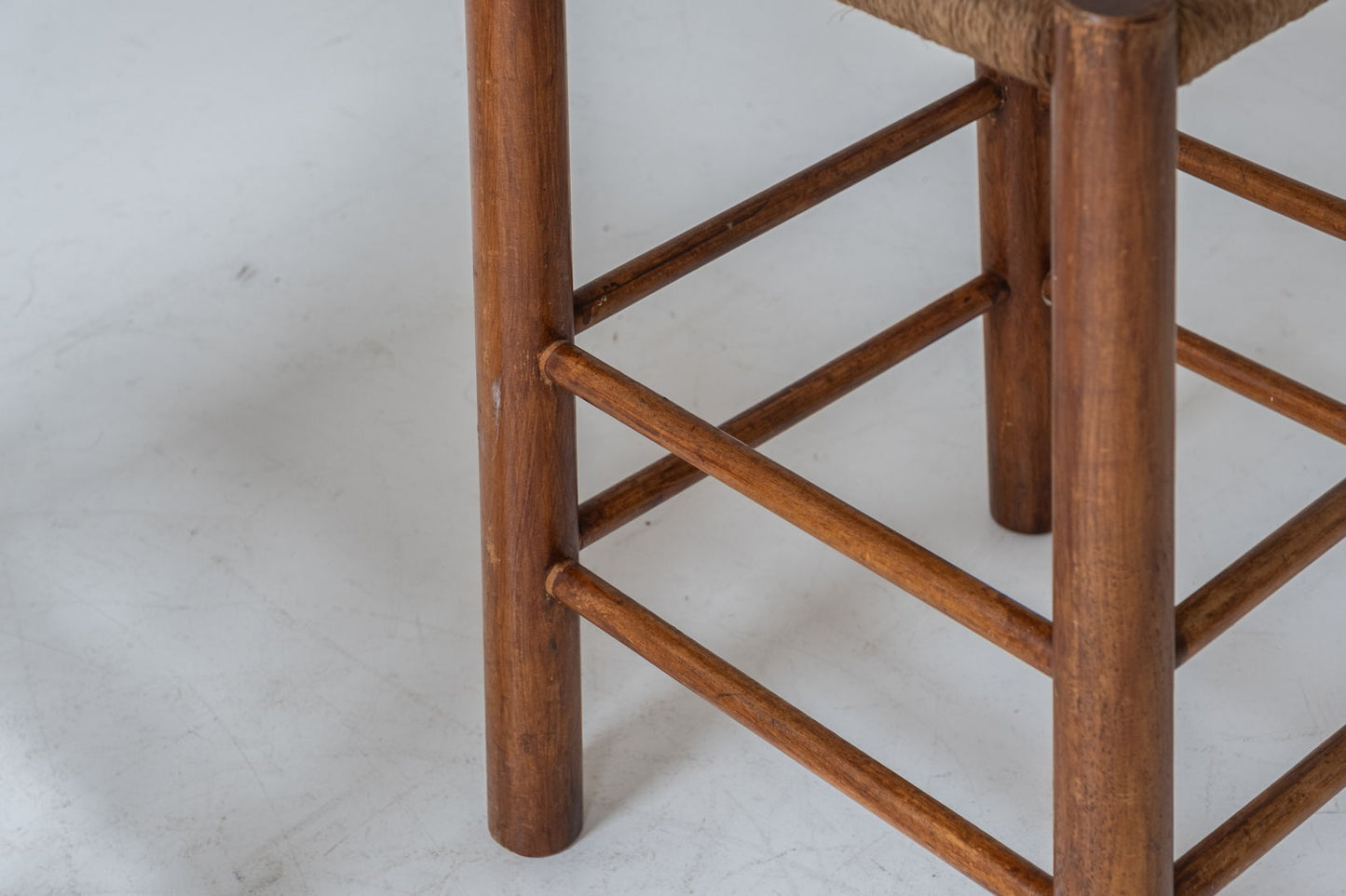 A charming set of two stools with papercord seats, crafted in France during the 1960s.