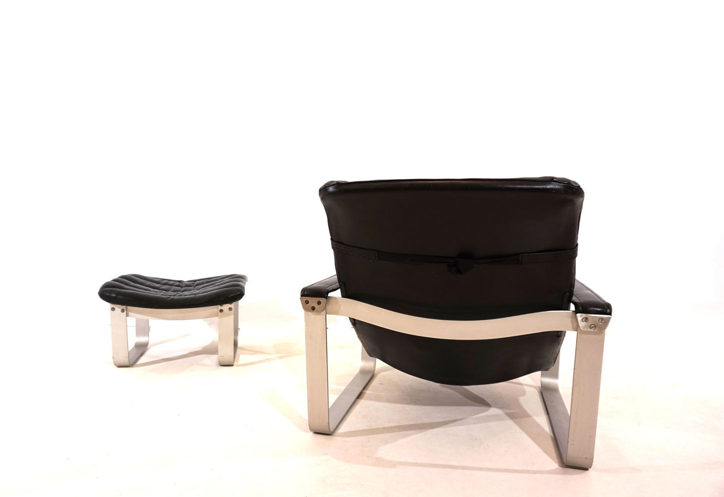 Asko Pulkka leather armchair with ottoman by Ilmari Lappalainen