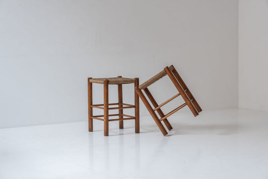 A charming set of two stools with papercord seats, crafted in France during the 1960s.