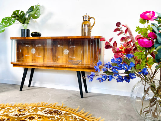 Art Deco display case with glazing beads and engraved glassware