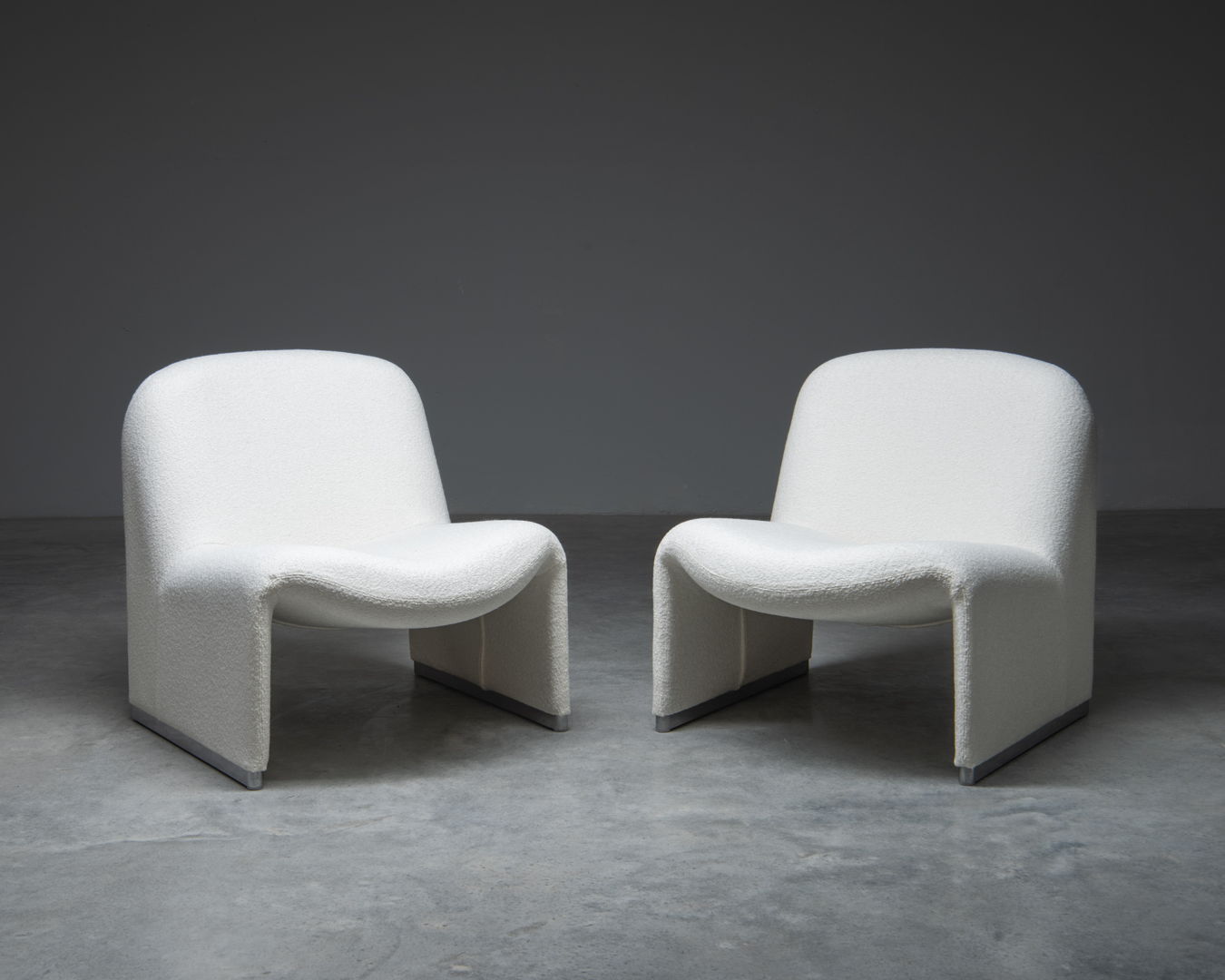 A pair of 'Alky' easy chairs, designed in the 1970s by Giancarlo Piretti for Castelli, Italy.