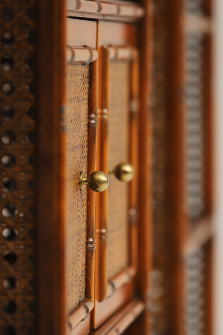 Pair of bohemian rattan bookcases with arch top and brass details 1970