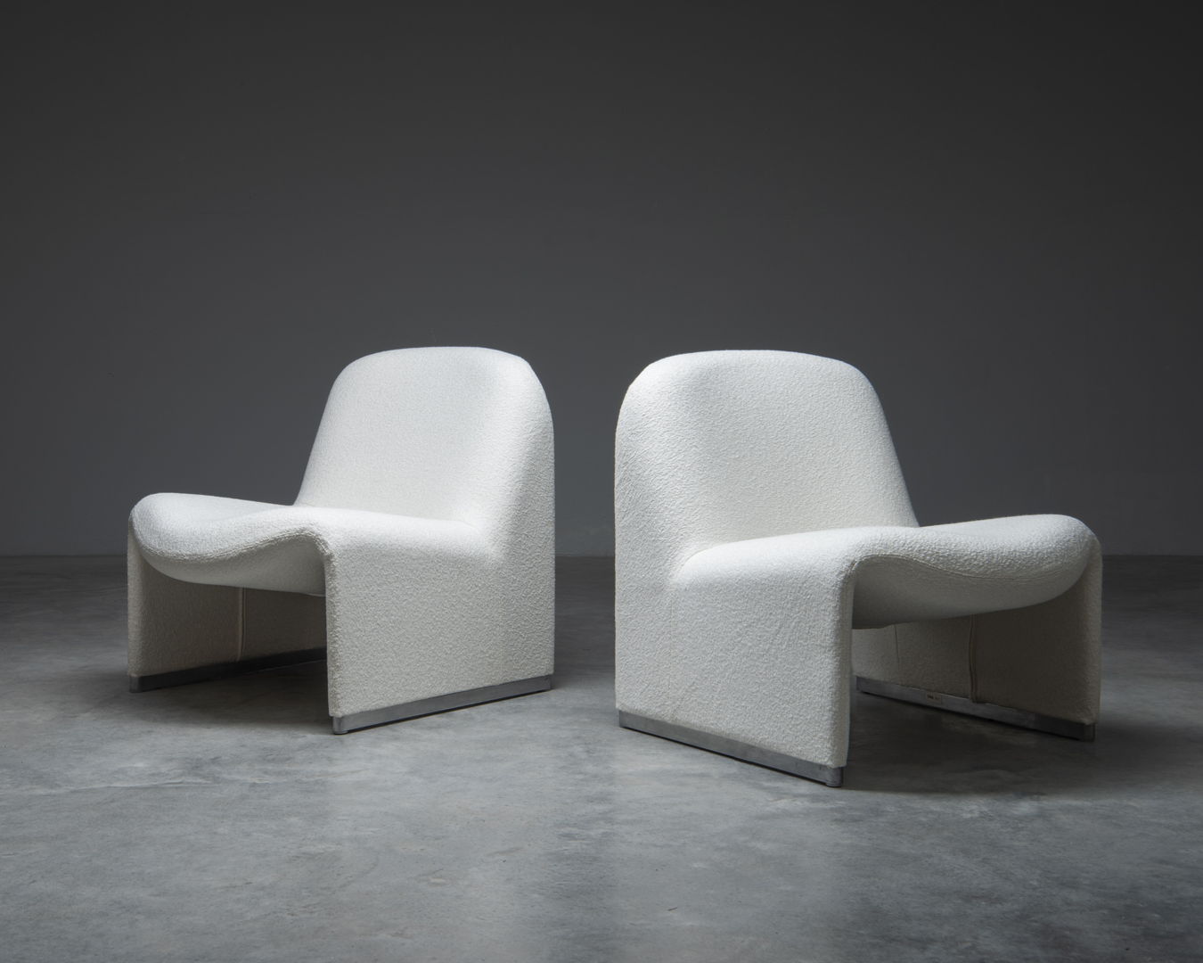 A pair of 'Alky' easy chairs, designed in the 1970s by Giancarlo Piretti for Castelli, Italy.