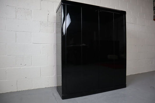 Black lacquered bar cabinet with Travertine top