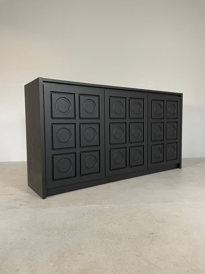 3 door black brutalist sideboard with circulair pattern