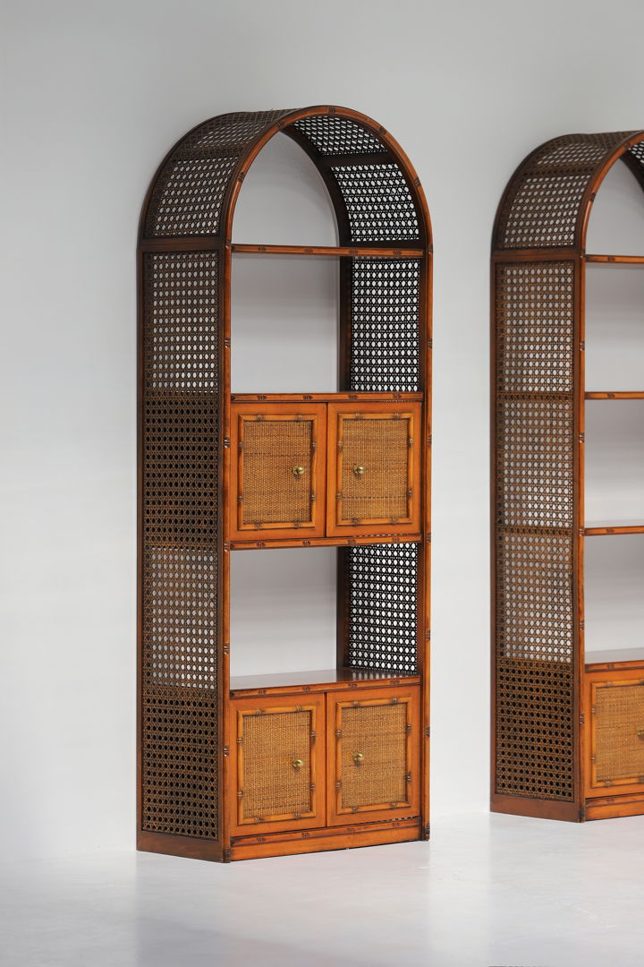 Pair of bohemian rattan bookcases with arch top and brass details 1970