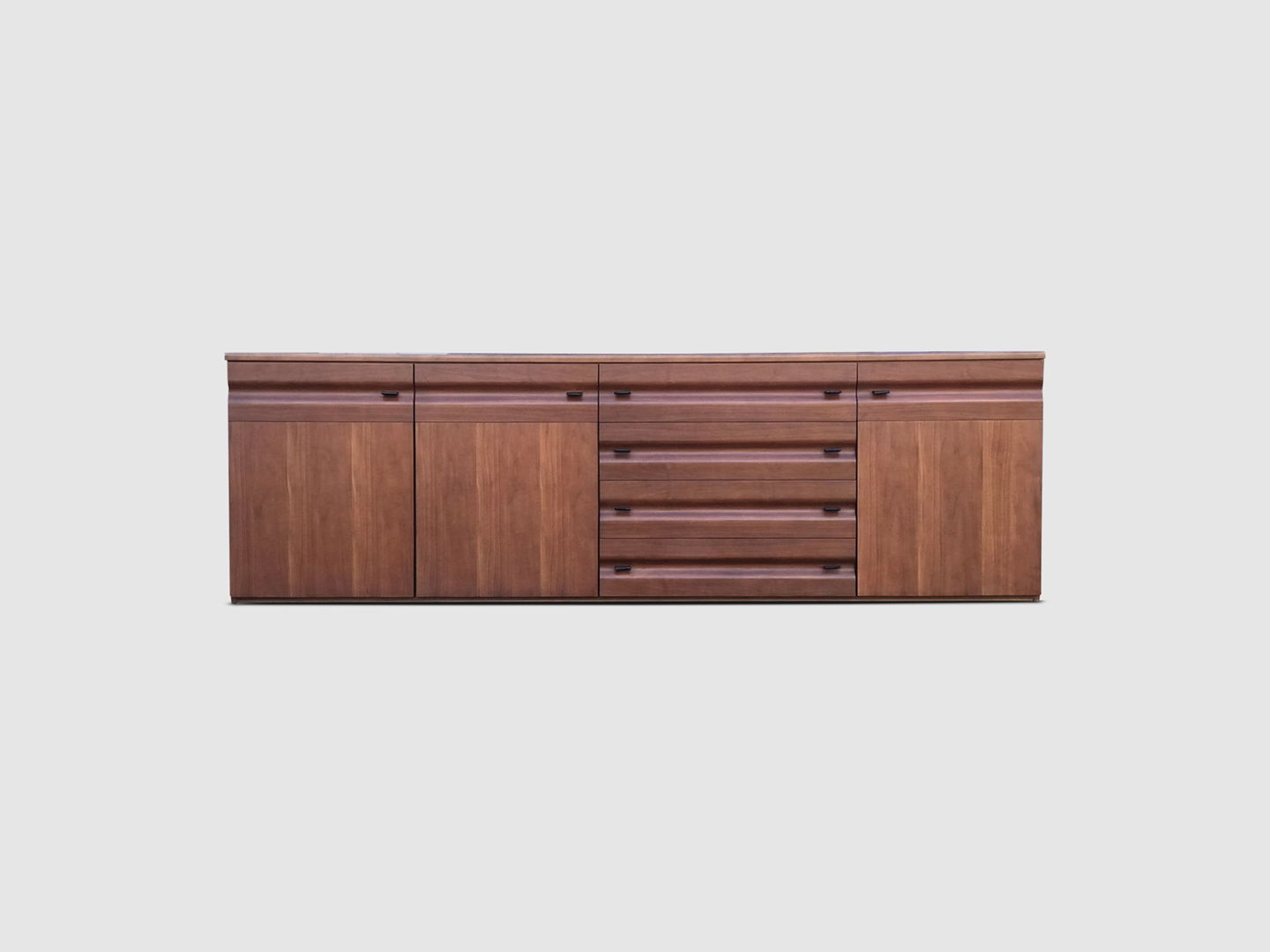 sculpted walnut and leather credenza Gavina Italy 1970s